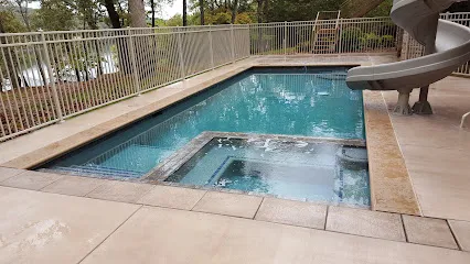 Logo of Rhodes Custom Pools, Inc.